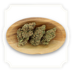 Load image into Gallery viewer, Dutch Punch CBD flower close up in wooden bowl on white background
