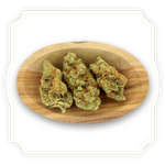 Load image into Gallery viewer, Photo of Gorilla Mandarine CBD tea flower buds in a wooden bowl
