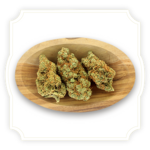 Photo of Gorilla Mandarine CBD tea flower buds in a wooden bowl