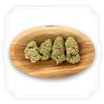 Load image into Gallery viewer, Photo of Ice Cream Cake CBD tea flower buds in a wooden bowl
