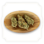 Load image into Gallery viewer, Solero Cream CBD flower close up in wooden bowl on white background
